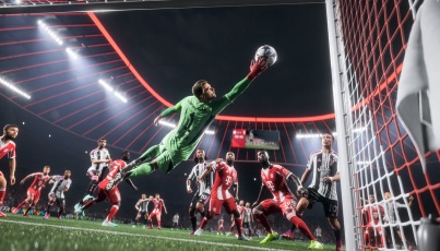 EA Sports FC gameplay moment showing a goalkeeper in a green kit diving mid-air to make a fingertip save inside a crowded penalty box, with players from both teams watching closely under the stadium floodlights.