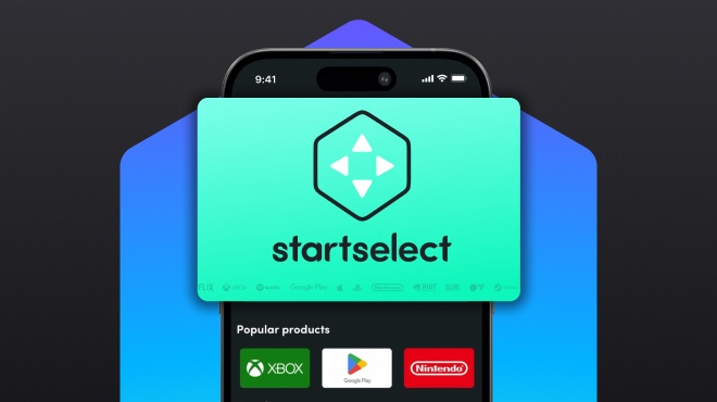 A smartphone screen showing the Startselect app with a large digital gift card featuring the Startselect logo in the foreground, and popular product icons like Xbox, Google Play, and Nintendo visible below.