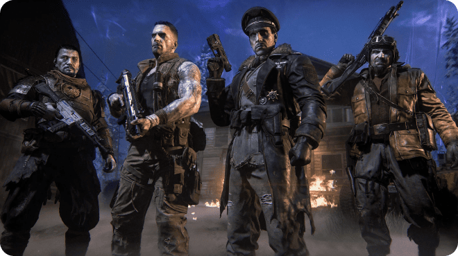 Four heavily armed characters stand in formation in front of a burning building at night. They wear rugged military and survival gear, illuminated by eerie blue light and fire in the background, suggesting a tense, post-apocalyptic scenario.